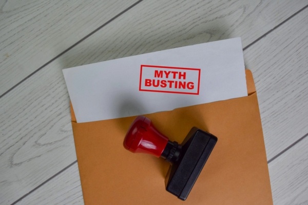 Myth Busting red stamp on document above brown envelope depicting 80 percent Fill Guideline