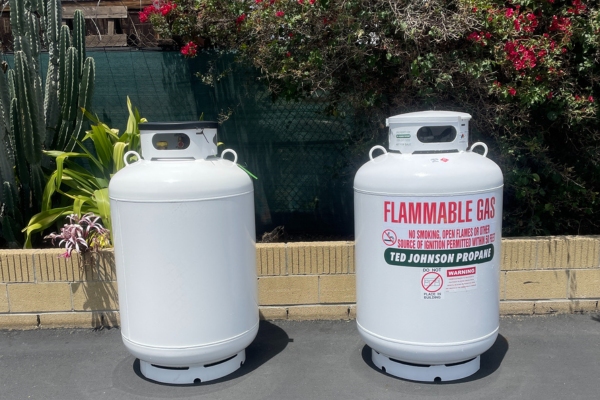Ted Johnson Propane propane tanks standing outside the garden