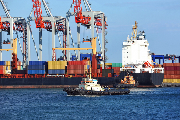 propane-powered tugboat assisting container cargo ship propane-powered tugboat assisting container cargo ship