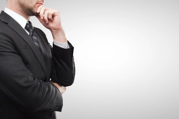 cropped view of a thinking businessman depicting choosing between propane-powered or electric forklift