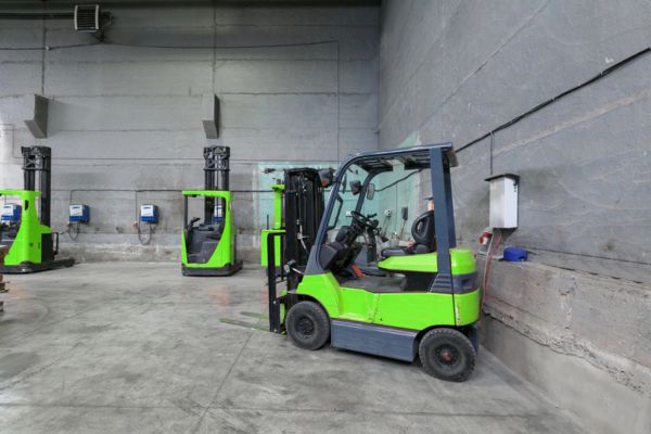 forklifts charging in the warehouse