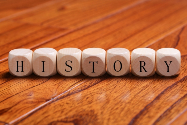 HISTORY word spelled using wooden letter dice depicting Origins and Evolution of Propane
