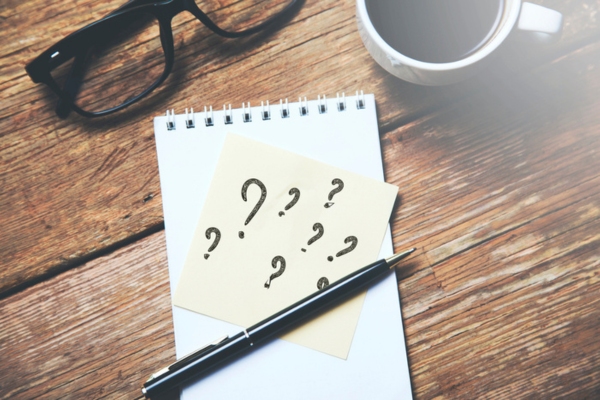 question marks on a sticky note on top of a notepad depicting Propane Myths FAQs