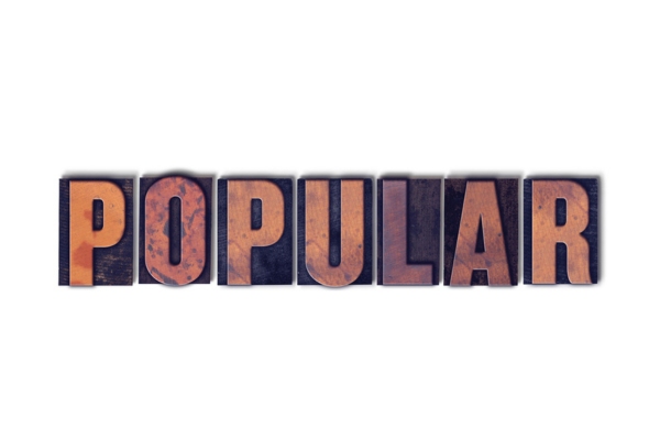 POPULAR word spelled using wooden letterpress