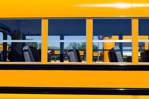 close up of school bus windows and chairs