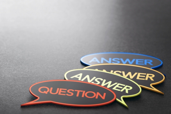 question answer written on a speech bubble cutout depicting Propane School Buses FAQs