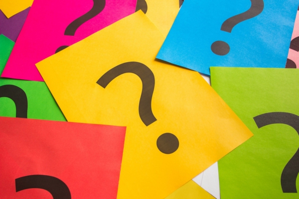 question mark on colored papers depicting Propane Fleet Costs FAQs