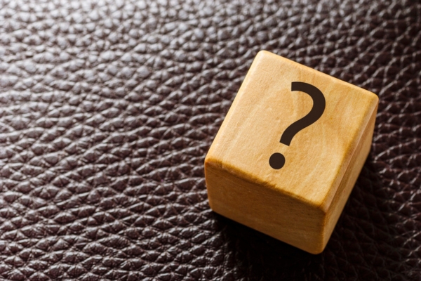 question mark on wooden cube depicting Propane Vs Diesel School Buses FAQs
