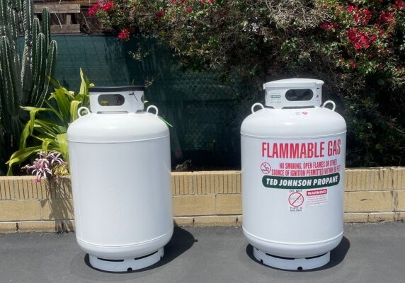 Ted Johnson Propane propane tanks standing outside the garden